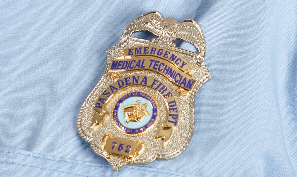 Close-up of a Pasadena Fire Department Emergency Medical Technician badge