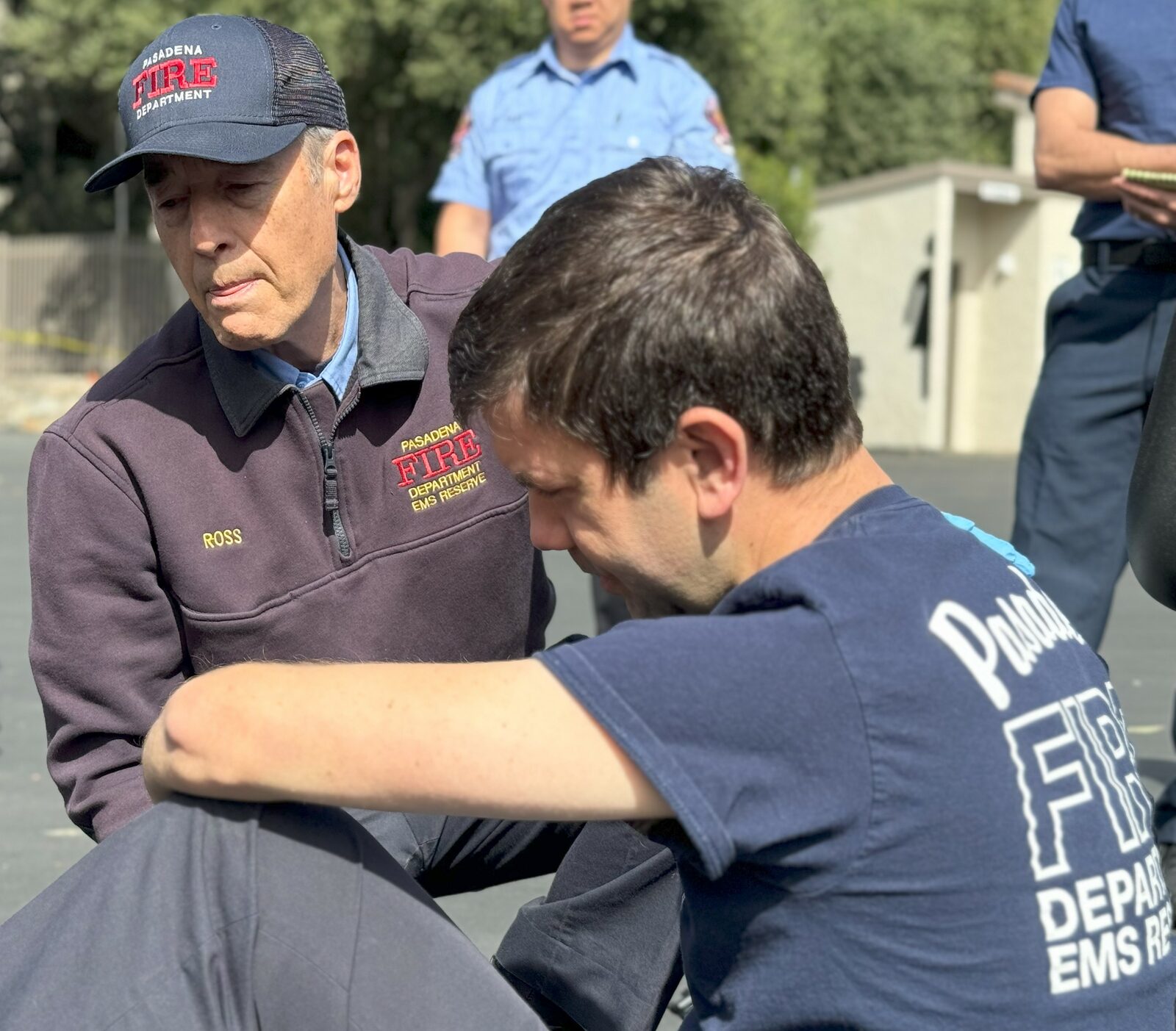 EMS Reserve members conferring during a training exercise