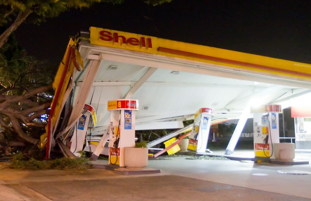A gas station canopy collapsed onto the pumps after a severe windstorm